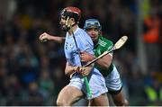 30 October 2022; Daithi Dempsey of Na Piarsaigh is tackled by Mark O'Loughlin of Kilmallock during the Limerick County Senior Club Hurling Championship Final match between Kilmallock and Na Piarsaigh at the TUS Gaelic Grounds in Limerick. Photo by Ben McShane/Sportsfile