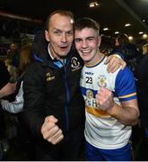 30 October 2022; Ruairi Canavan of Errigal Ciarán celebrates with his uncle Pascal Canavan after the Tyrone County Senior Club Football Championship Final match between Errigal Ciarán and Carrickmore at O'Neills Healy Park in Omagh, Tyrone.  Photo by Oliver McVeigh/Sportsfile