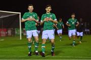 30 October 2022; James Roche of Ireland, left, celebrates with teammate Richard Vodo after scoring their side's winning penalty in the Victory Shield match between Republic of Ireland and Wales at the RSC in Waterford. Photo by Seb Daly/Sportsfile