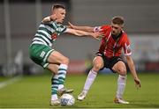 30 October 2022; Andy Lyons of Shamrock Rovers in action against Ronan Boyce of Derry City during the SSE Airtricity League Premier Division match between Shamrock Rovers and Derry City at Tallaght Stadium in Dublin. Photo by Ramsey Cardy/Sportsfile