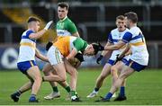 30 October 2022; Lorcan McGarrity of Carrickmore in action against Ruairi Canavan and Tommy Canavan of Errigal Ciarán during the Tyrone County Senior Club Football Championship Final match between Errigal Ciarán and Carrickmore at O'Neills Healy Park in Omagh, Tyrone.  Photo by Oliver McVeigh/Sportsfile