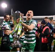 30 October 2022; Andy Lyons of Shamrock Rovers celebrates with the SSE Airtricity League Premier Division trophy after the SSE Airtricity League Premier Division match between Shamrock Rovers and Derry City at Tallaght Stadium in Dublin. Photo by Ramsey Cardy/Sportsfile