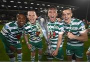30 October 2022; Shamrock Rovers players, from left, Aidomo Emakhu, Andy Lyons, Justin Ferizaj and Simon Power with the SSE Airtricity League Premier Division trophy after the SSE Airtricity League Premier Division match between Shamrock Rovers and Derry City at Tallaght Stadium in Dublin. Photo by Stephen McCarthy/Sportsfile