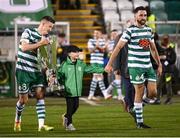 30 October 2022; Josh Bradley, son of manager Stephen Bradley, walks out the SSE Airtricity League Premier Division trophy with Ronan Finn and Roberto Lopes after the SSE Airtricity League Premier Division match between Shamrock Rovers and Derry City at Tallaght Stadium in Dublin. Photo by Stephen McCarthy/Sportsfile