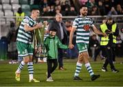 30 October 2022; Shamrock Rovers players Ronan Finn, left, Roberto Lopes and Josh Bradley, son of manager Stephen Bradley, bring the the SSE Airtricity League Premier Division trophy to the presentation area before the SSE Airtricity League Premier Division match between Shamrock Rovers and Derry City at Tallaght Stadium in Dublin. Photo by Stephen McCarthy/Sportsfile