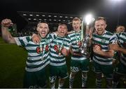 30 October 2022; Shamrock Rovers players, from left, Jack Byrne, Justin Ferizaj, Rory Gaffney, and Sean Hoare celebrate with the SSE Airtricity League Premier Division trophy after the SSE Airtricity League Premier Division match between Shamrock Rovers and Derry City at Tallaght Stadium in Dublin. Photo by Stephen McCarthy/Sportsfile