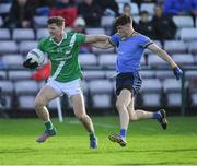 30 October 2022; Owen Gallagher of Moycullen in action against Donal Hunt captain of Salthill Knocknacarra during the Galway County Senior Club Football Championship Final match between Salthill Knocknacarra and Moycullen at Pearse Stadium in Galway. Photo by Ray Ryan/Sportsfile