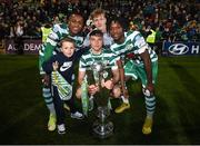 30 October 2022; Shamrock Rovers players, from left, Aidomo Emakhu, Justin Ferizaj, front, Tom Leitis and Gideon Tetteh celebrates with the SSE Airtricity League Premier Division trophy after the SSE Airtricity League Premier Division match between Shamrock Rovers and Derry City at Tallaght Stadium in Dublin. Photo by Stephen McCarthy/Sportsfile