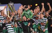 30 October 2022; Shamrock Rovers captain Ronan Finn lifts the trophy, alongside Shamrock Rovers manager Stephen Bradley, and his son Josh, after the SSE Airtricity League Premier Division match between Shamrock Rovers and Derry City at Tallaght Stadium in Dublin. Photo by Ramsey Cardy/Sportsfile