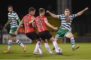 30 October 2022; Sean Hoare of Shamrock Rovers in action against Cameron Dummigan, 23, and Patrick McEleney of Derry City during the SSE Airtricity League Premier Division match between Shamrock Rovers and Derry City at Tallaght Stadium in Dublin. Photo by Stephen McCarthy/Sportsfile