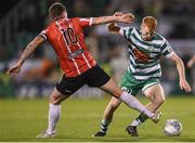 30 October 2022; Rory Gaffney of Shamrock Rovers in action against Patrick McEleney of Derry City during the SSE Airtricity League Premier Division match between Shamrock Rovers and Derry City at Tallaght Stadium in Dublin. Photo by Stephen McCarthy/Sportsfile
