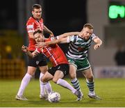 30 October 2022; Cameron Dummigan of Derry City in action against Sean Hoare of Shamrock Rovers during the SSE Airtricity League Premier Division match between Shamrock Rovers and Derry City at Tallaght Stadium in Dublin. Photo by Stephen McCarthy/Sportsfile