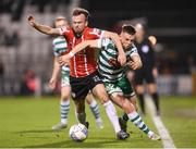 30 October 2022; Andy Lyons of Shamrock Rovers in action against Cameron Dummigan of Derry City during the SSE Airtricity League Premier Division match between Shamrock Rovers and Derry City at Tallaght Stadium in Dublin. Photo by Stephen McCarthy/Sportsfile