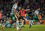 30 October 2022; Michael Duffy of Derry City shoots under pressure from Richie Towell, left, and Roberto Lopes of Shamrock Rovers during the SSE Airtricity League Premier Division match between Shamrock Rovers and Derry City at Tallaght Stadium in Dublin. Photo by Ramsey Cardy/Sportsfile
