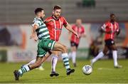30 October 2022; Roberto Lopes of Shamrock Rovers in action against Will Patching of Derry City during the SSE Airtricity League Premier Division match between Shamrock Rovers and Derry City at Tallaght Stadium in Dublin. Photo by Ramsey Cardy/Sportsfile