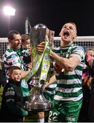 30 October 2022; Andy Lyons of Shamrock Rovers celebrates with the SSE Airtricity League trophy after the SSE Airtricity League Premier Division match between Shamrock Rovers and Derry City at Tallaght Stadium in Dublin. Photo by Ramsey Cardy/Sportsfile