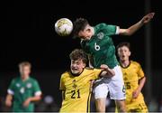 1 November 2022; Luke O'Donnell of Republic of Ireland in action against Ceadch O'Neill of Northern Ireland during the Victory Shield match between Republic of Ireland and Northern Ireland at Tramore AFC in Tramore, Waterford. Photo by Matt Browne/Sportsfile