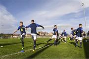 4 November 2022; Scotland captain Jack Fletcher and Ronan Ferns warm-up with their team-mates before the Victory Shield match between Republic of Ireland and Scotland at Tramore AFC in Tramore, Waterford. Photo by Matt Browne/Sportsfile