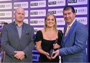 4 November 2022; Sara Doyle of Carlow is presented with her TG4 Junior Team of the Championship award by Mícheál Naughton, LGFA President, right, and Rónán Ó Coisdealbha, Head of Sport, TG4, at the 2022 TG4 Teams of the Championship awards night at Croke Park, Dublin. Photo by Seb Daly/Sportsfile