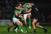 4 November 2022; Jacob Stockdale of Ireland, supported by team-mate Michael Lowry,  is tackled by Braydon Ennor, left, and Shaun Stevenson of All Blacks during the match between Ireland A and All Blacks XV at RDS Arena in Dublin. Photo by Brendan Moran/Sportsfile
