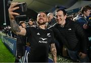 4 November 2022; TJ Perenara of All Blacks takes a selfie with supporters after the match between Ireland A and All Blacks XV at RDS Arena in Dublin. Photo by Brendan Moran/Sportsfile
