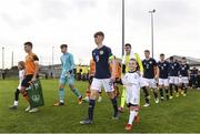4 November 2022; Scotland captain James Wilson leads his team-mates out for the start of the Victory Shield match between Republic of Ireland and Scotland at Tramore AFC in Tramore, Waterford. Photo by Matt Browne/Sportsfile