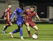 4 November 2022; Edward McCarthy of Galway United in action against Junior Quitirna of Waterford during the SSE Airtricity League First Division play-off final match between Waterford and Galway United at Markets Field in Limerick. Photo by Michael P Ryan/Sportsfile
