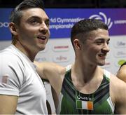 5 November 2022; Rhys McClenaghan of Ireland and his coach Luke Carson after winning a gold medal in the Men's Pommel Horse Final during the World Artistic Gymnastics Championships 2022 at The M&S Bank Arena in Liverpool, England. Photo by Sportsfile
