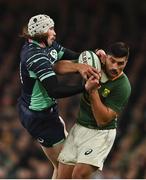 5 November 2022; Mack Hansen of Ireland and Damian de Allende of South Africa contest a dropping ball during the Bank of Ireland Nations Series match between Ireland and South Africa at the Aviva Stadium in Dublin. Photo by Brendan Moran/Sportsfile
