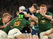 5 November 2022; Garry Ringrose of Ireland is tackled by Damian de Allende, left, Cheslin Kolbe, 15, and Steven Kitshoff of South Africa during the Bank of Ireland Nations Series match between Ireland and South Africa at the Aviva Stadium in Dublin. Photo by Seb Daly/Sportsfile