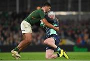 5 November 2022; Mack Hansen of Ireland is tackled by Damian de Allende of South Africa during the Bank of Ireland Nations Series match between Ireland and South Africa at the Aviva Stadium in Dublin. Photo by Ramsey Cardy/Sportsfile