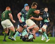 5 November 2022; Eben Etzebeth of South Africa, with team mate Steven Kitshoff, 1, in support, is tackled by James Ryan and Caelan Doris of Ireland during the Bank of Ireland Nations Series match between Ireland and South Africa at the Aviva Stadium in Dublin. Photo by Brendan Moran/Sportsfile