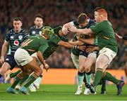 5 November 2022; Garry Ringrose of Ireland is tackled by Kurt-Lee Arendse, Cheslin Kolbe and Steven Kitshoff of South Africa during the Bank of Ireland Nations Series match between Ireland and South Africa at the Aviva Stadium in Dublin. Photo by Brendan Moran/Sportsfile