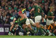 5 November 2022; Mack Hansen of Ireland is tackled by Cheslin Kolbe, 15, and Pieter-Steph du Toit of South Africa during the Bank of Ireland Nations Series match between Ireland and South Africa at the Aviva Stadium in Dublin. Photo by Seb Daly/Sportsfile