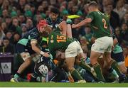 5 November 2022; Mack Hansen of Ireland is tackled by Cheslin Kolbe, 15, and Pieter-Steph du Toit of South Africa during the Bank of Ireland Nations Series match between Ireland and South Africa at the Aviva Stadium in Dublin. Photo by Seb Daly/Sportsfile