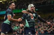 5 November 2022; Mack Hansen of Ireland, centre, celebrates with teammates Jimmy O'Brien, behind, and Hugo Keenan after scoring their side's second try during the Bank of Ireland Nations Series match between Ireland and South Africa at the Aviva Stadium in Dublin. Photo by Seb Daly/Sportsfile