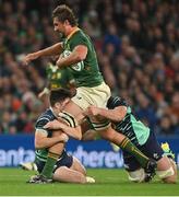 5 November 2022; Eben Etzebeth of South Africa is tackled by Jimmy O'Brien and Caelan Doris of Ireland during the Bank of Ireland Nations Series match between Ireland and South Africa at the Aviva Stadium in Dublin. Photo by Brendan Moran/Sportsfile