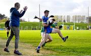 6 November 2022; Conor Rooney of Ratoath in action against Keith Murphy of Rhode as Ratoath manager David Brady watches on during the AIB Leinster GAA Football Senior Club Championship quarter-final match between Ratoath and Rhode at Páirc Tailteann in Navan, Meath. Photo by Eóin Noonan/Sportsfile