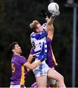 6 November 2022; James Burke of Naas in action against Rory O’Carroll, left, and Ben Shovlin of Kilmacud Crokes during the AIB Leinster GAA Football Senior Club Championship Quarter-Final match between Kilmacud Crokes and Naas at Parnell Park in Dublin. Photo by Daire Brennan/Sportsfile