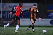 6 November 2022; Darragh Leahy of Dundalk in action against James Akintunde of Derry City during the SSE Airtricity League Premier Division match between Derry City and Dundalk at The Ryan McBride Brandywell Stadium in Derry. Photo by Ben McShane/Sportsfile