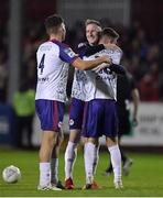 6 November 2022; Ben McCormack of St Patrick's Athletic, right, celebrates with team-mate Joe Redmond, left, and Ian Bermingham after scoring their side's fourth during the SSE Airtricity League Premier Division match between St Patrick's Athletic and Shelbourne at Richmond Park in Dublin. Photo by Tyler Miller/Sportsfile