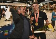 7 November 2022; Gold medallist Rhys McClenaghan of Ireland with his father Danny on his return from the World Artistic Gymnastics Championships 2022, at Dublin Airport in Dublin. Photo by David Fitzgerald/Sportsfile