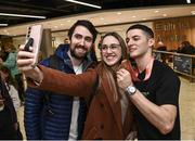 7 November 2022; Gold medallist Rhys McClenaghan of Ireland with supporters Michelle McGlone and Diarmuid Connaughty from Monaghan on his return from the World Artistic Gymnastics Championships 2022, at Dublin Airport in Dublin. Photo by David Fitzgerald/Sportsfile
