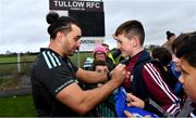 10 November 2022; James Lowe signs an autograph for Cillian Kelly, aged 11, from Tankardtown Cross, Carlow, during the Leinster rugby open training session at Tullow RFC in Carlow. Photo by Sam Barnes/Sportsfile
