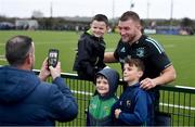 10 November 2022; Ross Molony poses for a photograph with brothers, from left, Adam Roberts, aged 5, Zack Roberts, aged 8, and Bill Roberts, aged 11,  during the Leinster rugby open training session at Tullow RFC in Carlow. Photo by Sam Barnes/Sportsfile