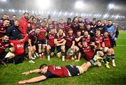 10 November 2022; Munster players celebrate with the shield as Jack O’Donoghue slides in after their side's victory in the match between Munster and South Africa Select XV at Páirc Ui Chaoimh in Cork. Photo by Harry Murphy/Sportsfile