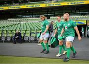 11 November 2022; Ireland players, from left, Cian Prendergast, Jack Crowley and Jeremy Loughman make their way onto the pitch for their captain's run at Aviva Stadium in Dublin. Photo by Brendan Moran/Sportsfile