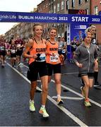 30 October 2022; Claire O' Donnell, left, and Rachel Harper, both from Donegal, compete in the 2022 Irish Life Dublin Marathon. 25,000 runners took to the Fitzwilliam Square start line to participate in the 41st running of the Dublin Marathon after a two-year absence. Photo by Sam Barnes/Sportsfile