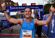 30 October 2022; Jonathan Dever from Dublin 6 celebrates after finishing the 2022 Irish Life Dublin Marathon. 25,000 runners took to the Fitzwilliam Square start line to participate in the 41st running of the Dublin Marathon after a two-year absence. Photo by Sam Barnes/Sportsfile