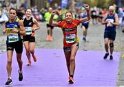 30 October 2022; Marion Dowling from Carlow, centre, celebrates finishing the 2022 Irish Life Dublin Marathon. 25,000 runners took to the Fitzwilliam Square start line to participate in the 41st running of the Dublin Marathon after a two-year absence. Photo by Sam Barnes/Sportsfile